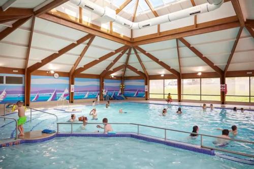 a group of people in a swimming pool at Kent Coast 3 bedroom holiday home in Rochester