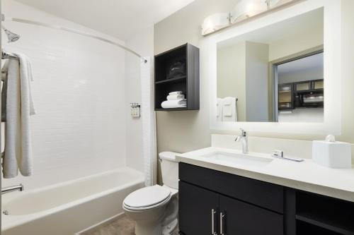 a bathroom with a sink and a toilet and a mirror at Candlewood Suites - Lebanon, an IHG Hotel in Lebanon