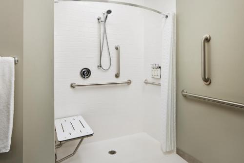 a shower stall in a bathroom with a toilet at Candlewood Suites - Lebanon by IHG in Lebanon