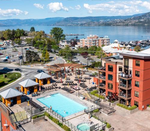an aerial view of a resort with a swimming pool at Resort Style Living with Private Lawn and Patio in Kelowna