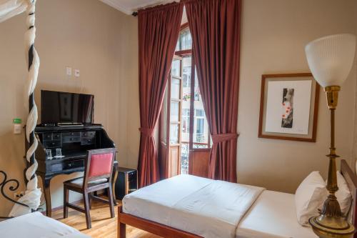 Postel nebo postele na pokoji v ubytování Santa Lucia House - Forum