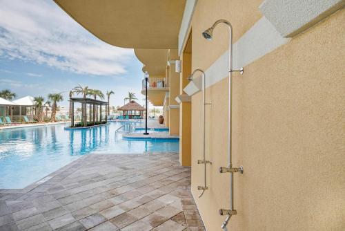 a view of the swimming pool at a resort at Calypso 3-1601 - Corine's Corner in Panama City Beach