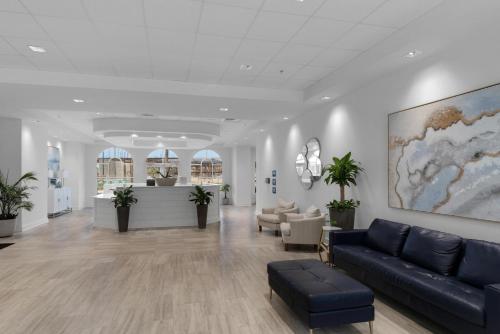 a lobby with a couch and chairs in a building at Calypso 3-1601 - Corine's Corner in Panama City Beach