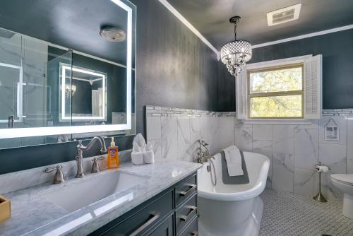 a bathroom with a sink and a toilet and a mirror at Lakefront Retreat in Jefferson with Screened Porch! in Jefferson