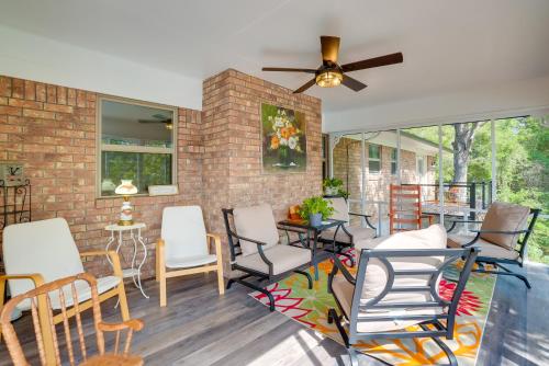 a living room with chairs and a brick wall at Lakefront Retreat in Jefferson with Screened Porch! in Jefferson