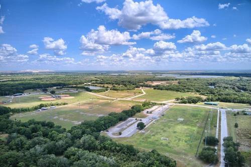 an aerial view of a park with trees and a road at Elegant Home with Pool, Office, Theater, and Fence in Lakeland