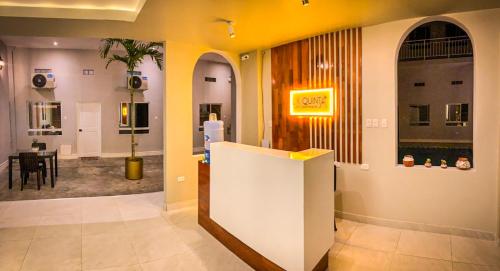 a lobby with a reception desk and a dining room at La Quinta Loft Apartments in Iquitos