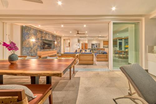 a living room with a table and a couch at Maxwell Residences at Indah in Puerto Vallarta