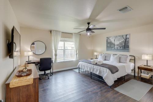 a bedroom with a bed and a ceiling fan at Modern Killeen Vacation Rental with Private Patio! in Killeen