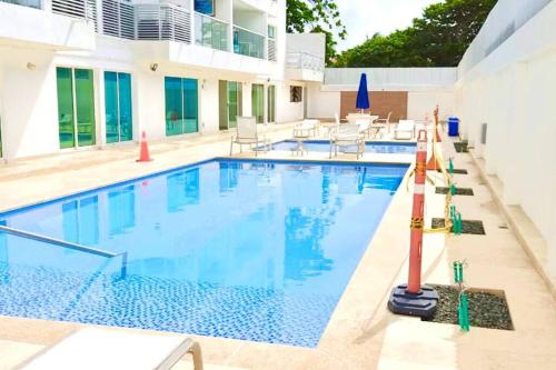 a large swimming pool with blue water at Sea View 603B in San Andrés