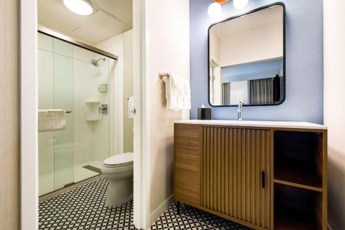 a bathroom with a sink and a toilet at Sonesta Select Philadelphia Airport in Philadelphia