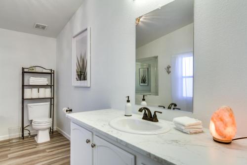 a white bathroom with a sink and a toilet at Phoenix Family Home Near Cave Creek and Hiking! in Phoenix