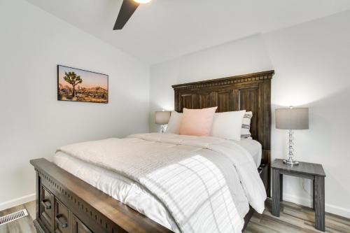 a bedroom with a large bed with a wooden headboard at Phoenix Family Home Near Cave Creek and Hiking! in Phoenix
