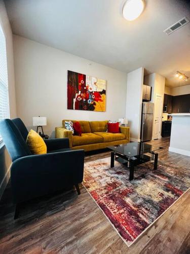 a living room with two couches and a table at FIFA WORLD CUP! Close to Dallas Love Field Airport Downtown Dallas Medical District in Dallas