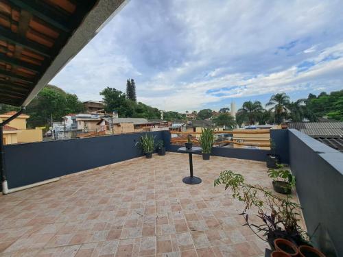 a view from the roof of a house with plants at RustiCidade in São Paulo