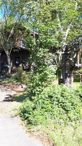 a street sign in front of a stone house at Bistare Kana in Niseko