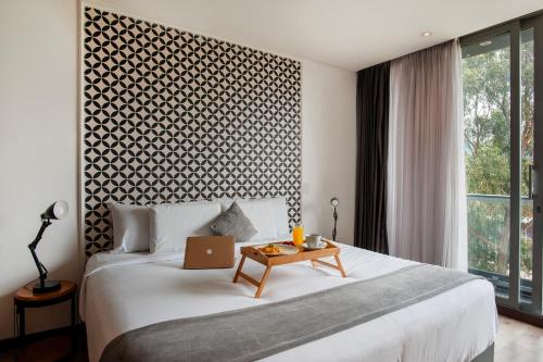 Cama o camas de una habitación en Hemma Bogotá Country Luxury Suites Hotel