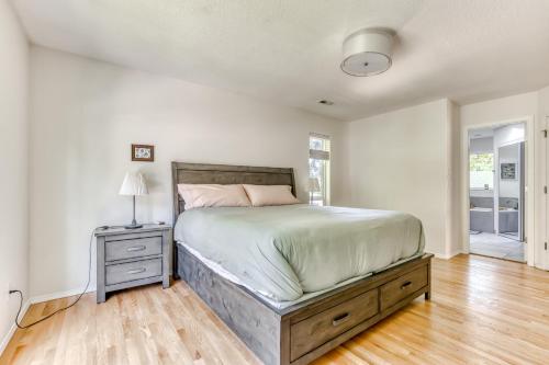 a bedroom with a large bed and a wooden floor at Raleigh Hills Retreat in Portland