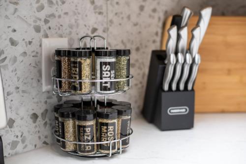 a group of canisters on a counter next to a knife block at Beautiful 6 bed 3 bath home in quiet neighborhood in Wichita