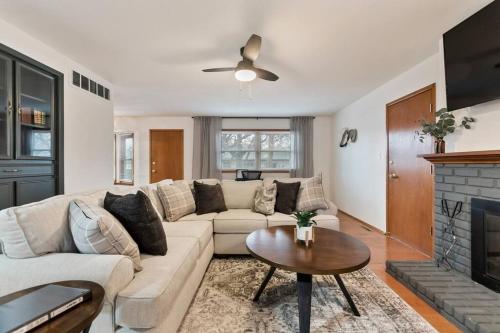 a living room with a couch and a fireplace at 3 Bed 2 Bath Home w 2 Car Garage & Fitness Room in Wichita