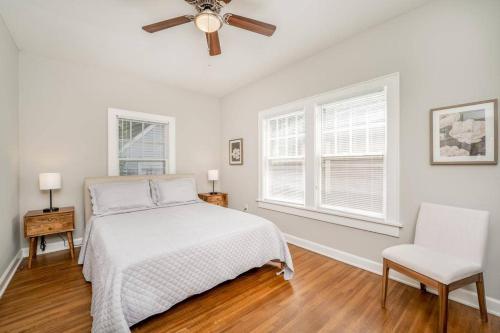 a white bedroom with a bed and a ceiling fan at 3 Bed 1 5 Bath Home By College Hill & Hospitals in Wichita