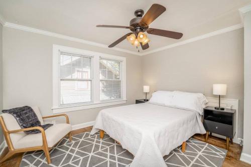 a bedroom with a bed and a ceiling fan at 3 Bed 1 5 Bath Home By College Hill & Hospitals in Wichita