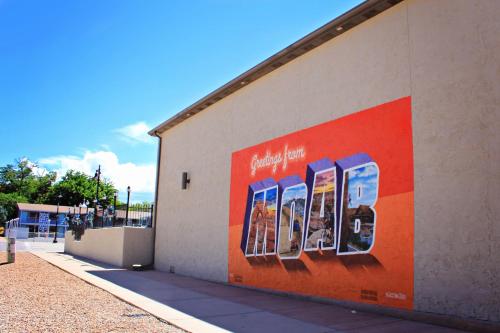an advertisement on the side of a building at Bowen Motel in Moab