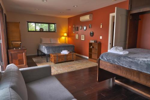 a living room with two beds and a couch at Stunning Home & Spectacular View in La Mesa