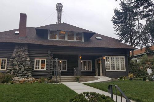 a black house with a tower on top of it at Alki Beach Cottage, NEW, 2 bedrooms, 2 bathrooms, near beach, AC, WD, Parking in Seattle