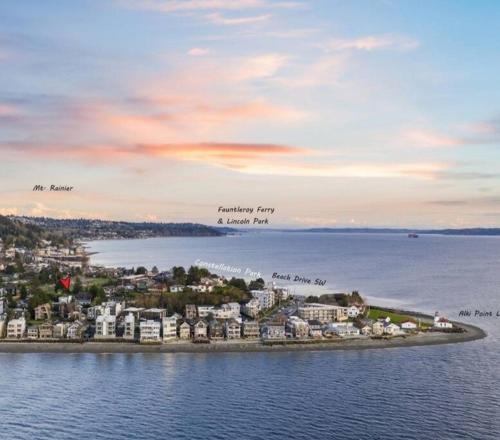 an island in the water with houses and buildings at Alki Beach Cottage, NEW, 2 bedrooms, 2 bathrooms, near beach, AC, WD, Parking in Seattle