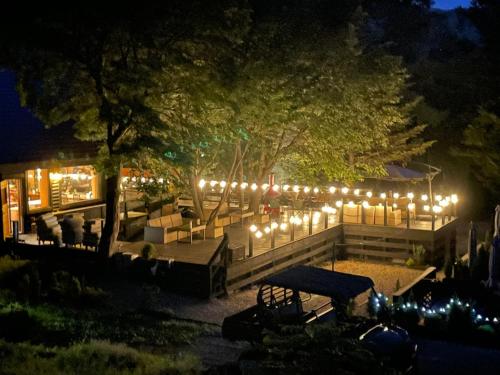a patio lit up with lights at night at ユニテ蔵王ジョーニダ リゾート in Yamagata