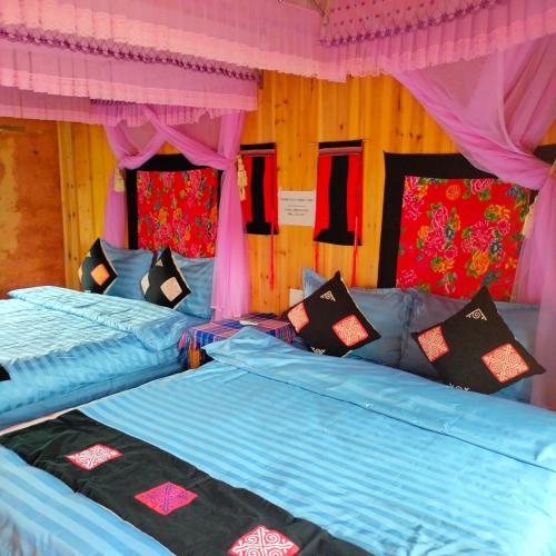 Katil atau katil-katil dalam bilik di Hong Thu Homestay & Bungalow