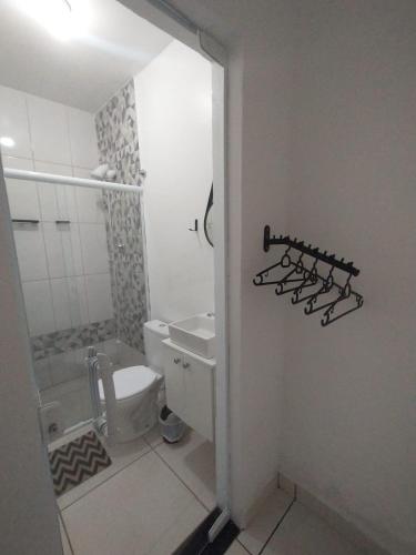 a bathroom with a toilet and a sink at DuPai 8 Sorocaba in Sorocaba