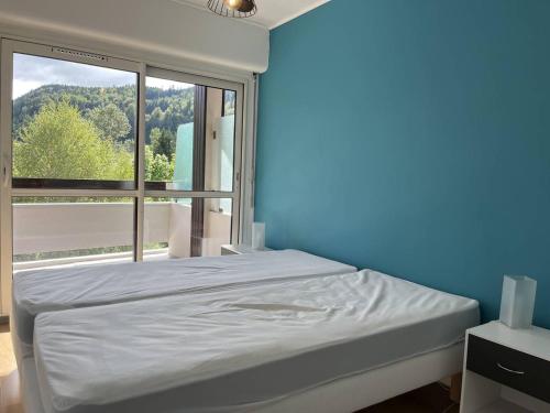 Postel nebo postele na pokoji v ubytování Appartement fonctionnel à Villard-de-Lans, balcon, parking gratuit - FR-1-548-40