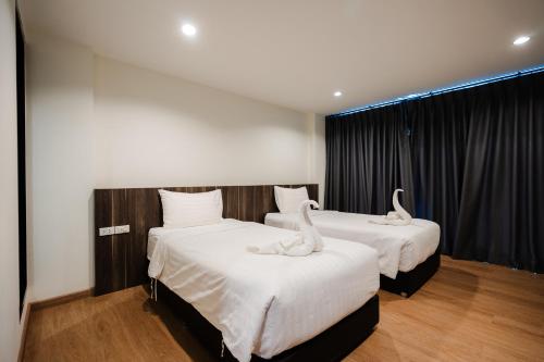 Postel nebo postele na pokoji v ubytování JS HOTEL