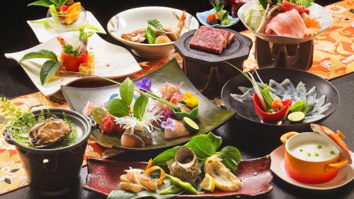 a table with many plates of food on it at リゾートホテル美萩 in Hagi