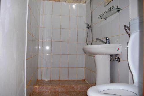 a bathroom with a sink and a toilet at Marina Park in Vama Veche