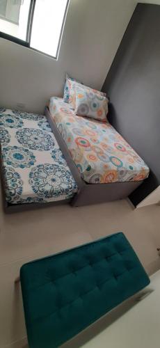 a room with a bed and a pillow in a room at APARTAMENTO EN BUCARAMANGA, ZONA CENTRICA in Bucaramanga