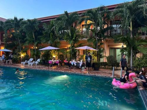 a group of people in the pool at a hotel at Siam Tara Resort Chiangkhong in Chiang Khong