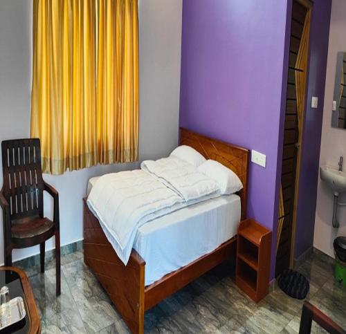 Ein Bett oder Betten in einem Zimmer der Unterkunft Selva Inn