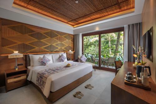 Postel nebo postele na pokoji v ubytování The Hava Ubud A Pramana Experience