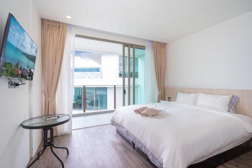 Кровать или кровати в номере Oceana Sea View - Kamala Beach
