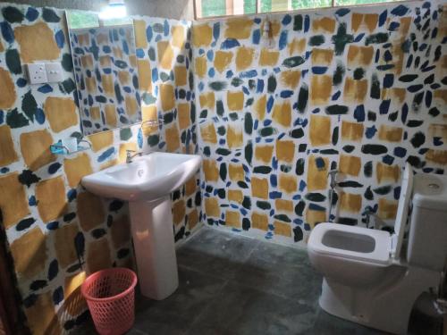 a bathroom with a sink and a toilet at Green Herbal Ayurvedic Eco-Chalets in Galle