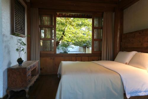 Ένα ή περισσότερα κρεβάτια σε δωμάτιο στο My love inn 吾爱堂