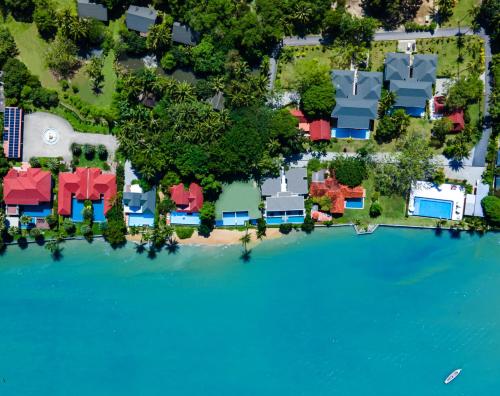 an aerial view of a house on an island in the water at Fisherman Way Beach Villa - SHA Extra Plus in Rawai Beach