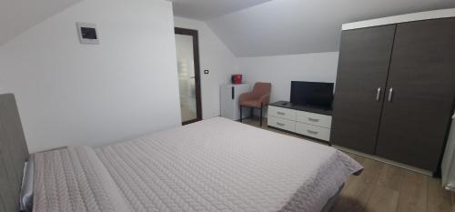 Ένα ή περισσότερα κρεβάτια σε δωμάτιο στο Casa TOP