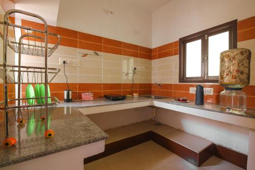 Kuchyň nebo kuchyňský kout v ubytování Manora Residency