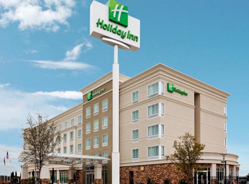 a hotel with a sign in front of a building at Holiday Inn Hotel & Suites Waco Northwest by IHG in Bellmead