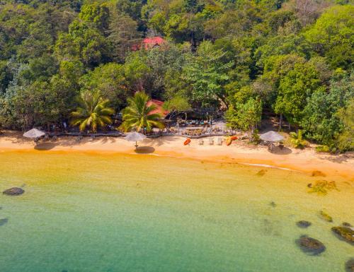 an aerial view of a beach with trees at Tree House Bungalows in Koh Rong Island
