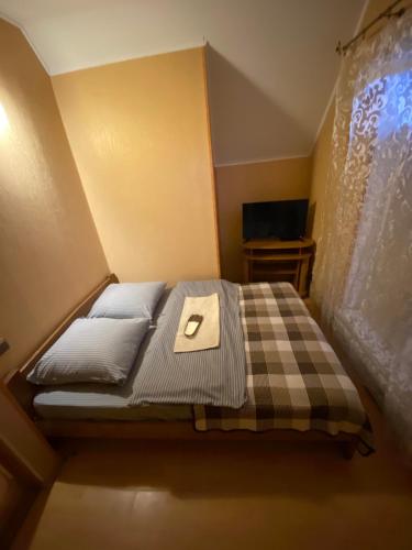 Postel nebo postele na pokoji v ubytování Inn Khlibodarskiy